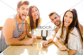Group selfie at the beach bar