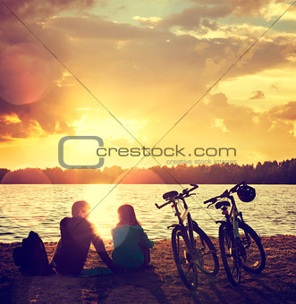 Romantic Couple with Bikes by the Lake