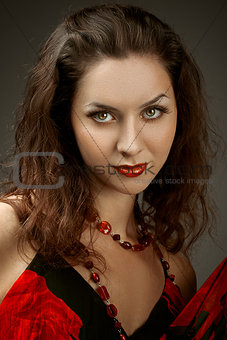 Fashion photo of a young woman with dark hair