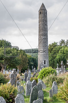 Tablet in the Glendalough Cemetery and The Round Tower