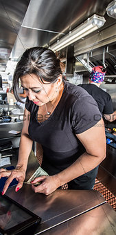 Cashier with Money in Food Truck