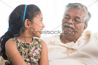 Grandfather and granddaughter communicate