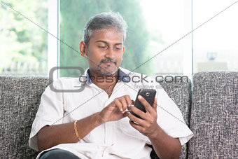 Indian man using smartphone