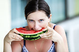 Woman eating watermelon