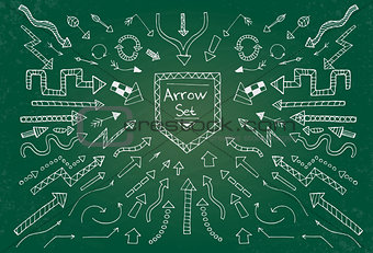 Hand drawn arrow icons set on green chalk board