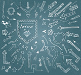 Hand drawn arrow icons set on blue chalk board