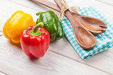 Colorful bell peppers and kitchen utensil