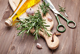 Fresh garden rosemary with garlic and olive oil