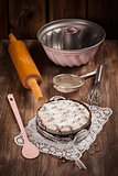 White and chocolate Christmas cake with baking utensils
