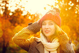Young Woman in Beanie Hat on Autumn Background