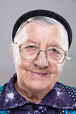 Portrait of an elderly woman with glasses