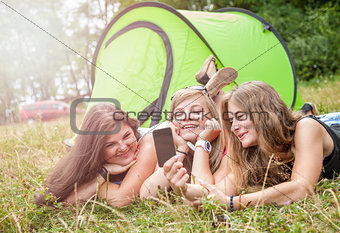 Group of friends taking a picture on their camping holiday