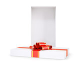 Gift box with red ribbon on white