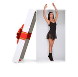 Ballerina in gift box on white