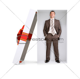 Businessman in gift box on white