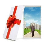 Cityscape with walking businessman in gift box