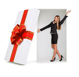 Happy businesswoman in gift box