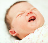 Portrait of crying newborn baby