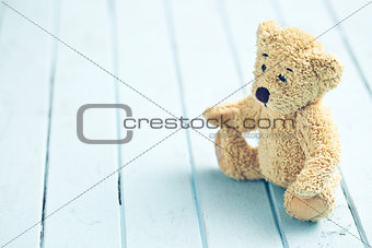teddy bear on blue table
