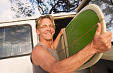 Happy Man Removing Surfboard