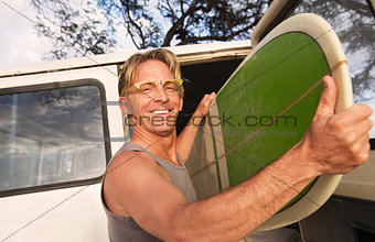 Happy Man Removing Surfboard