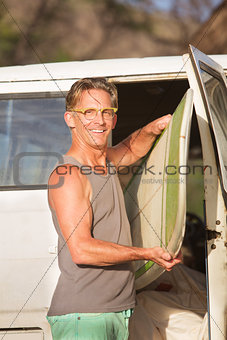 Person with Surfboard in Van