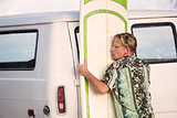 Man Lifting Heavy Surfboard