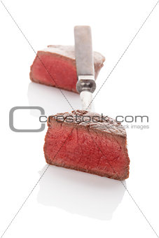 Delicious steak on fork.