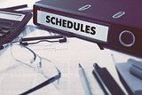 Schedules on Office Folder. Toned Image.