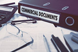 Commercial Documents on Ring Binder. Blured, Toned Image.
