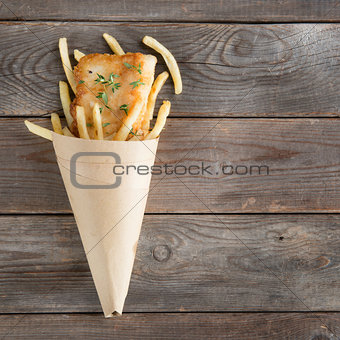 Top view fish and chips in paper cone