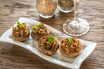 Mushrooms\' caps stuffed with mixture of cheese and onion