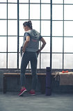 Rear view of woman in workout gear in city loft gym