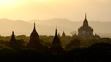 Sunset scenic view with silhouettes of temples in Bagan, Myanmar