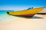 Traditional wooden boat on a tropical beach