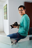 Asian Man Connect DSLR To PC Download Pictures On Laptop