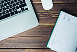 Laptop and diary on the desk