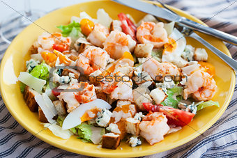 Fresh shrimps, eggs, croutons and vegetables salad 