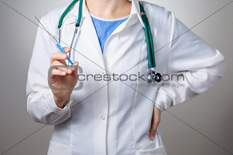 Female doctor with syringe