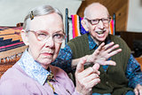 Angry Old Couple in Livingroom