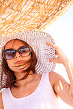 Girl in a hat in summer