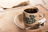 Traditional kopitiam style Nanyang coffee in vintage mug