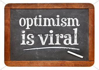 optimism is viral - text on blackboard