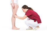 Physiotherapist doing a knee evaluation