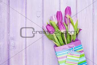 Purple tulip bouquet in gift bag