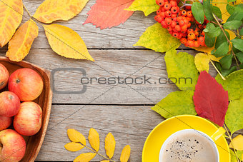 Autumn leaves, apple fruits and coffee cup