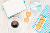 Coffee, heart shaped cookies and notepad