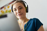 Woman With Green Earphones Listens Podcast Music On Tablet