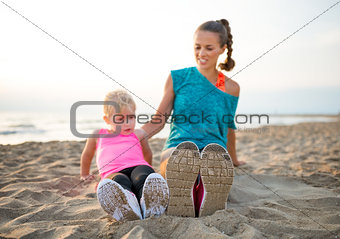 Closeup of mother and child comparing running shoes