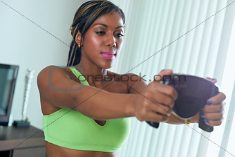 Black Athlete Woman Measures Body Fat With Electronic Equipment